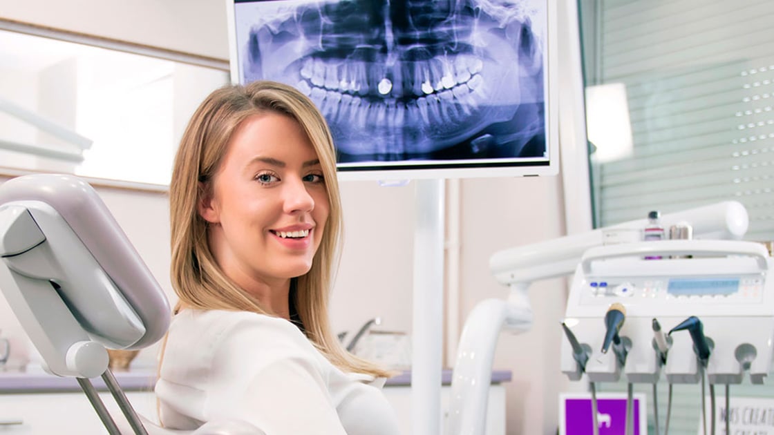 Lady in Dental Chair with 3D image of teeth